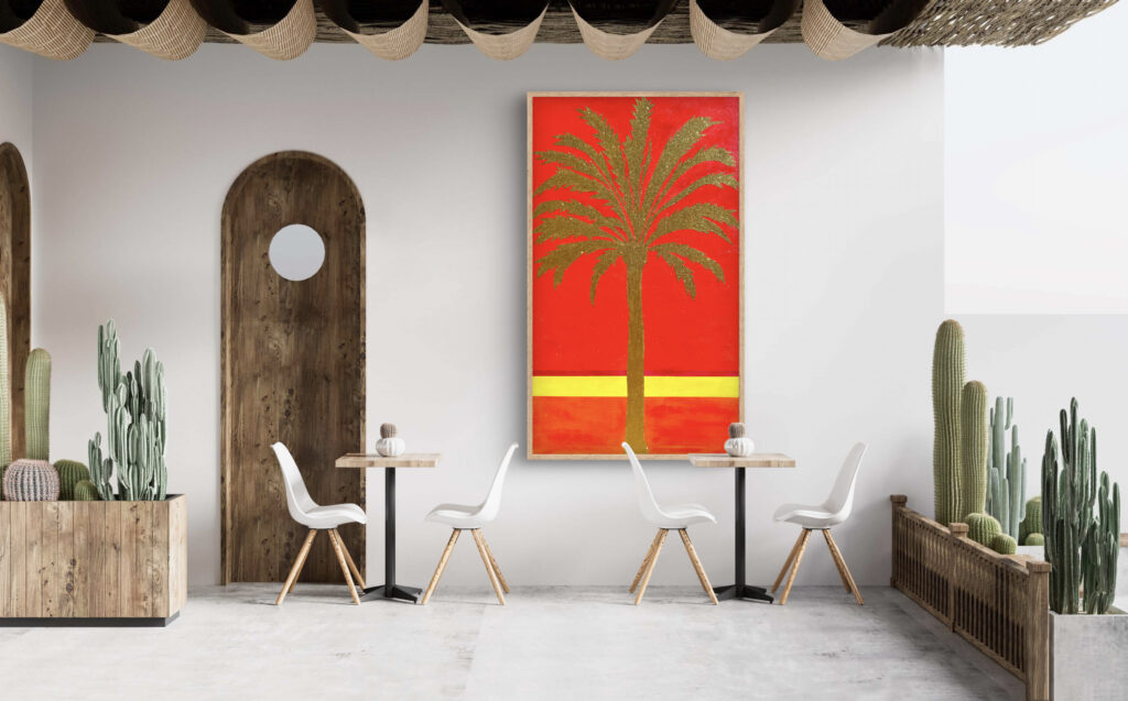 A modern interior scene featuring two small tables with white chairs, a large red painting of a palm tree on the wall, and various cacti displayed in wooden planters. The room has a minimalist design with a circular window in a wooden arch and a light-toned floor.