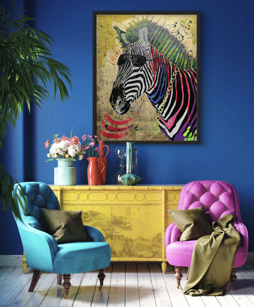 A vibrant interior scene featuring a framed colorful artwork of a zebra wearing sunglasses and adorned with accessories. The setting includes a yellow sideboard, pink and blue armchairs, and decorative vases, all against a bold blue wall. A potted plant and a bouquet of flowers add a touch of greenery.